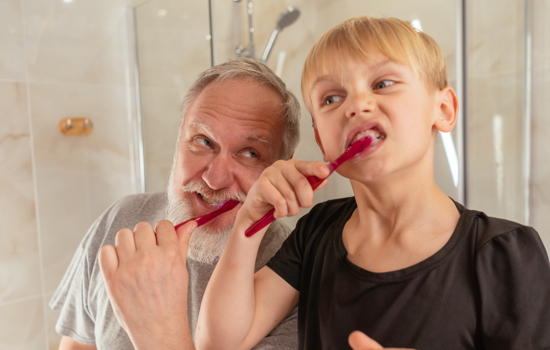 Adult and Child brushing teeth
